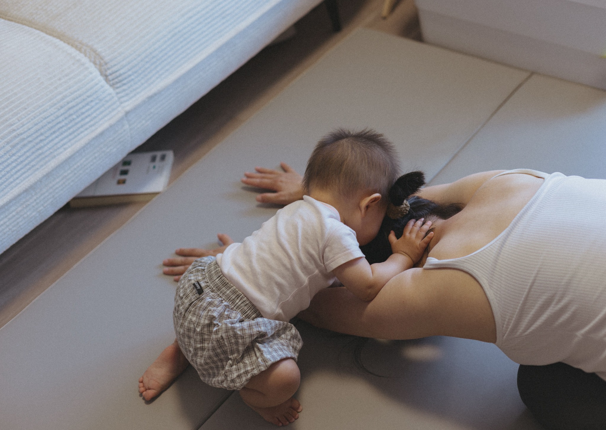 Mother and baby during postnatal yoga